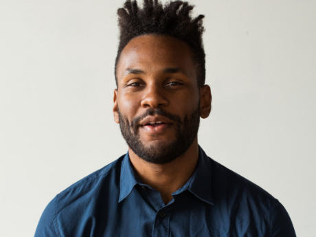 Man in a blue button up shirt.